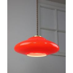 a red light hanging from a ceiling in a room