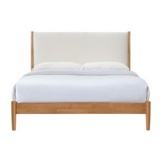 a bed with white sheets and pillows on it's headboard, against a white background