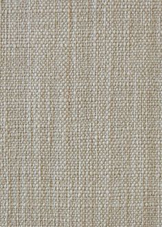 an upholstered beige fabric textured with small white dots