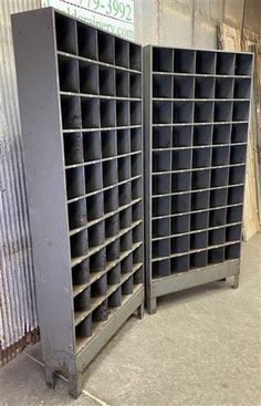 two metal storage racks with black tires on them