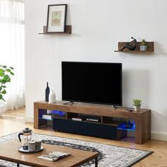 a living room with a coffee table and television