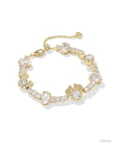 Celebrate joyful style and Disney fun with the Disney | Kendra Scott Gold Mickey Mouse and Minnie Mouse Tennis Bracelet in White Crystal. From the miniature iterations of Disney’s eternal sweethearts to its gorgeous crystal details, there’s so much to love about this timeless tennis bracelet. As elegant as it is whimsical, this wrist stack stunner will have you smiling ear to ear. Metal 14k Yellow Gold Over Brass Material White CZ Closure Lobster Clasp W/ Single Adjustable Slider Bead Size 6.5"W Gold Mickey Mouse, Disney Charm Bracelet, Mickey Mouse And Minnie Mouse, Wrist Stacks, Disney Charms, Bar Jewelry, Greek Jewelry, Disney Jewelry, Zodiac Jewelry