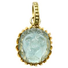 18K aquamarine hand carved lionshead pendant by master Idar Oberstein carver. 15mm Lion Jewelry, Contemporary Necklace, Carved Stone, Metal Engraving, Aquamarine Stone, Modern Necklaces, Gold Hands, Modern Pendant, Stone Cuts