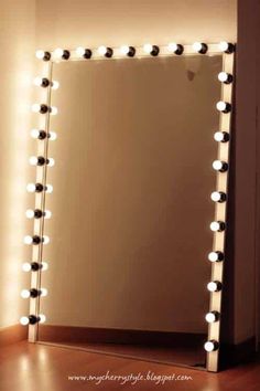 a mirror that has some lights on it