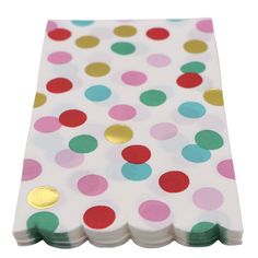 a white napkin with multicolored polka dots on it