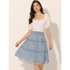 Inspired by a romantic style, this skirt will lend some feminine style to your look. Made of lightweight chiffon, a tiered ruffle hem, midi length, and floral printed patterns overall, it completes a vintage silhouette. This sweet floral skirt is designed with a floaty tiered ruffle hem and a smocked waist. Pair it with flats or heels for a pretty and sweet style. Day Out Smocked Bodice Skirt, Spring Tiered Skirt With Smocked Bodice, Blue Flowy Feminine Skirt, Feminine Flowy Blue Skirt, Casual Blue Skirt With Smocked Bodice, Tiered Skirt With Smocked Bodice For Brunch, Brunch Tiered Skirt With Smocked Bodice, Mini Skirt With Smocked Bodice For Brunch, Tiered Gathered Feminine Skirt