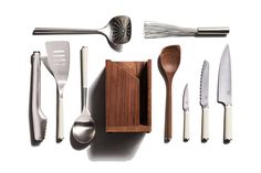 the kitchen utensils are laid out in a box and ready to be used