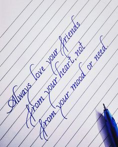 a notepad with writing on it and a blue pen next to it that says, love your friends from our heart not from your mood or need