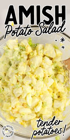 a bowl filled with potato salad on top of a wooden table