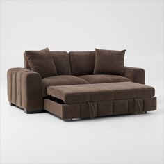 a brown couch sitting on top of a white floor