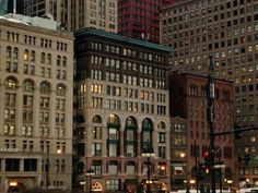 a city street filled with lots of tall buildings