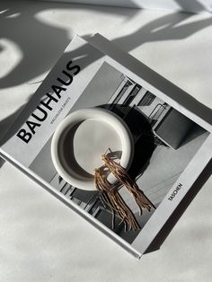 a book with an image of a bowl on top of it and the title bauhaus