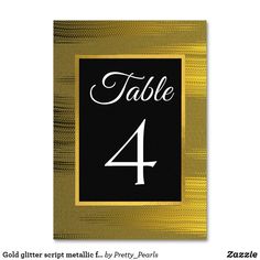 a black and gold table number card with the word table 4 in white on it