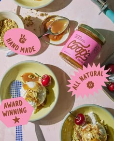 three bowls of food with labels on them sitting on a table next to each other