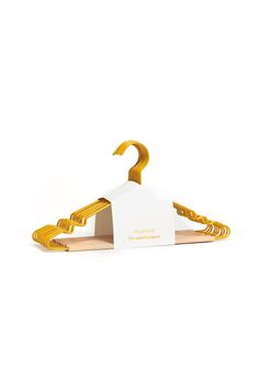 a yellow and white hanger on a white background