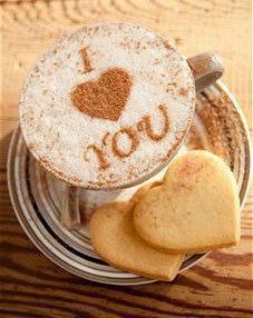 two cookies in a jar with the word i love you written on it next to some heart shaped cookies