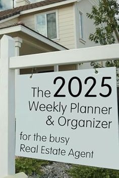 a real estate sign in front of a house