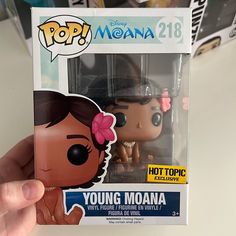 a pop vinyl figure in a box with a pink bow on her head and the words young moan written below it