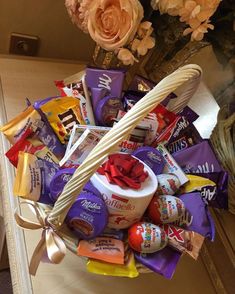 a basket filled with candy and candies on top of a table