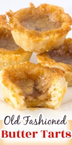 old fashioned butter tarts on a plate with the words old fashioned butter tarts