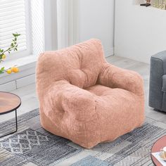 a living room with two couches and a rug on the floor in front of it