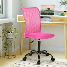 a bright pink office chair sits in front of a desk with a laptop on it