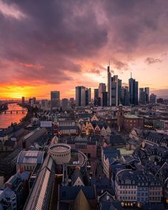 an aerial view of a city at sunset