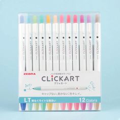 a set of 12 different colored markers in a display case on a light blue background