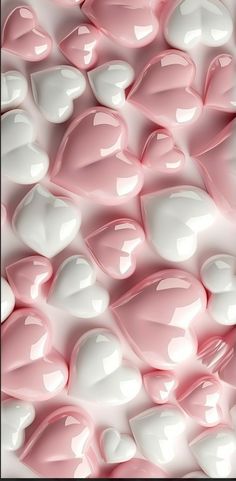 pink and white candy hearts are arranged in the shape of heart shaped candies, as if for valentine's day