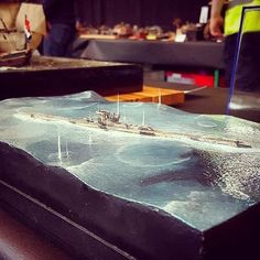 a model of a battleship is on display