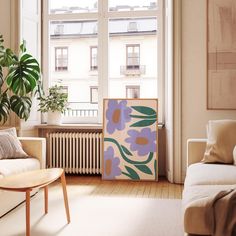 a living room filled with furniture and a painting on the wall next to a window