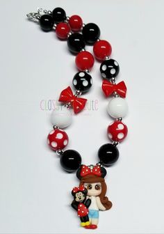 This listing is for one Minnie and Me Necklace.  Necklace is available in 16 or 18 inches in length.   Lobster clasp closure with a 2 inch extender chain.   20mm acrylic bubblegum beads in red, black, polka dot red and white, and polka dot black and white beads.   24mm red acrylic bow beads.  Pendant is made of polymer clay material.  6mm silver spacer beads.  Matching beaded bracelets available for additional charge upon requests. Just contact me.  Thank you for looking. 😊 Product color may di Cute Red Round Jewelry, Cute Round Red Jewelry, Plastic Round Beads Necklace For Gift, Fun Red Round Jewelry, Fun Red Resin Jewelry, Cute Red Necklace For Parties, Cute Black Resin Jewelry, Playful Red Adjustable Necklace, White Plastic Necklace For Gift