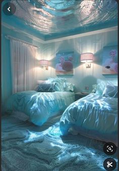 two beds in a room with blue sheets and blankets on the floor, one is under water