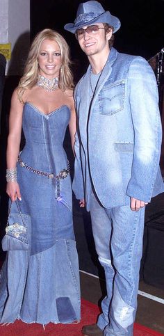 a man and woman dressed up in blue outfits