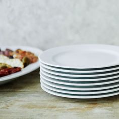 white plates stacked on top of each other