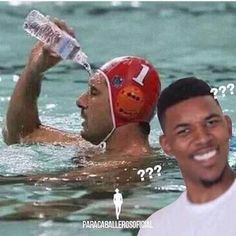 a man holding a water bottle next to another man wearing a swimming cap in the water