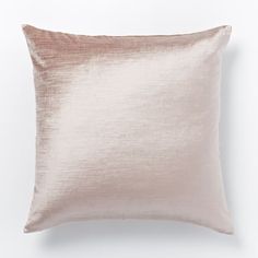 a pink pillow on a white background