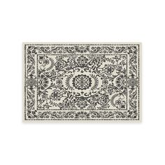 a black and white rug with an intricate design on the bottom, in front of a white background