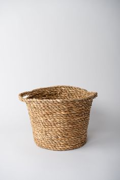 a large woven basket on a white background