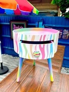 a colorful table with an umbrella in the background