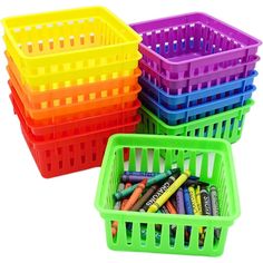 three plastic baskets with crayons in them