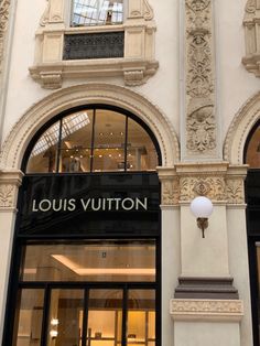 the entrance to louis vuitton store in paris, france with its arched windows