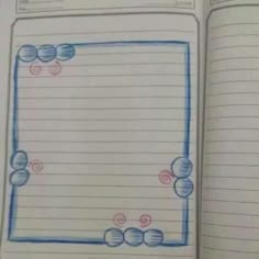 an open notebook with lines and circles drawn on it