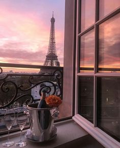 a view of the eiffel tower from an apartment balcony