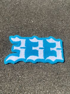 a blue and white sticker sitting on the ground