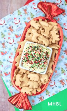 a tray filled with cookies and sprinkles on top of a table