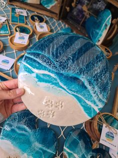 a person holding up a blue and white plate