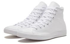 a pair of white sneakers on a white background