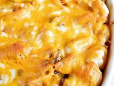 a casserole dish with chicken and cheese