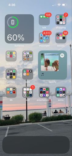 an image of a cell phone screen with various icons on it and the sky in the background